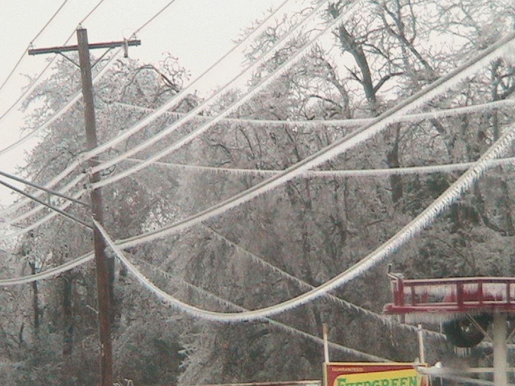 Telephone poles covered in ice